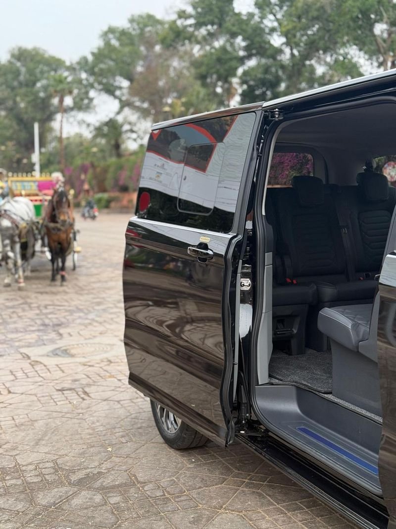 Our black van with its sliding door open, ready for passengers